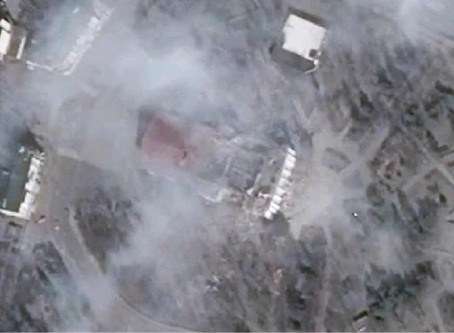 The image documents the destroyed theater building 15 minutes after the attack. Fields of debris surround the theater on the north and south sides, with the roof of the entrance part almost intact. 16.03.2022. ©CNES/Airbus